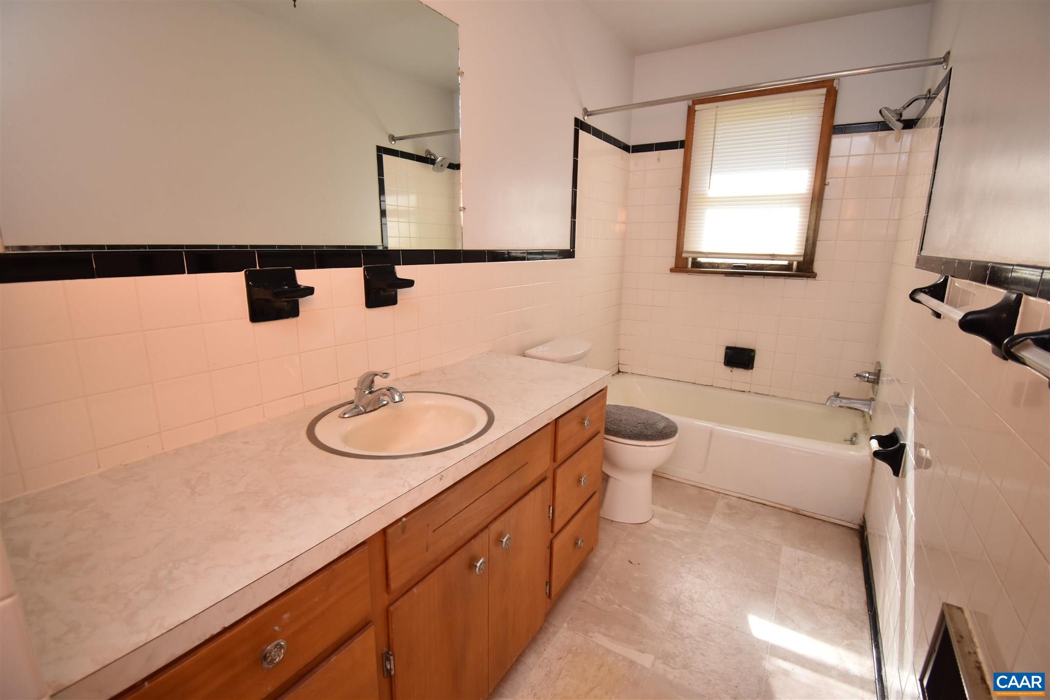 26 Warmar Road Ruckersville, VA 22968 - Photo 18 of 30 a bathroom with a sink a toilet a mirror and shower