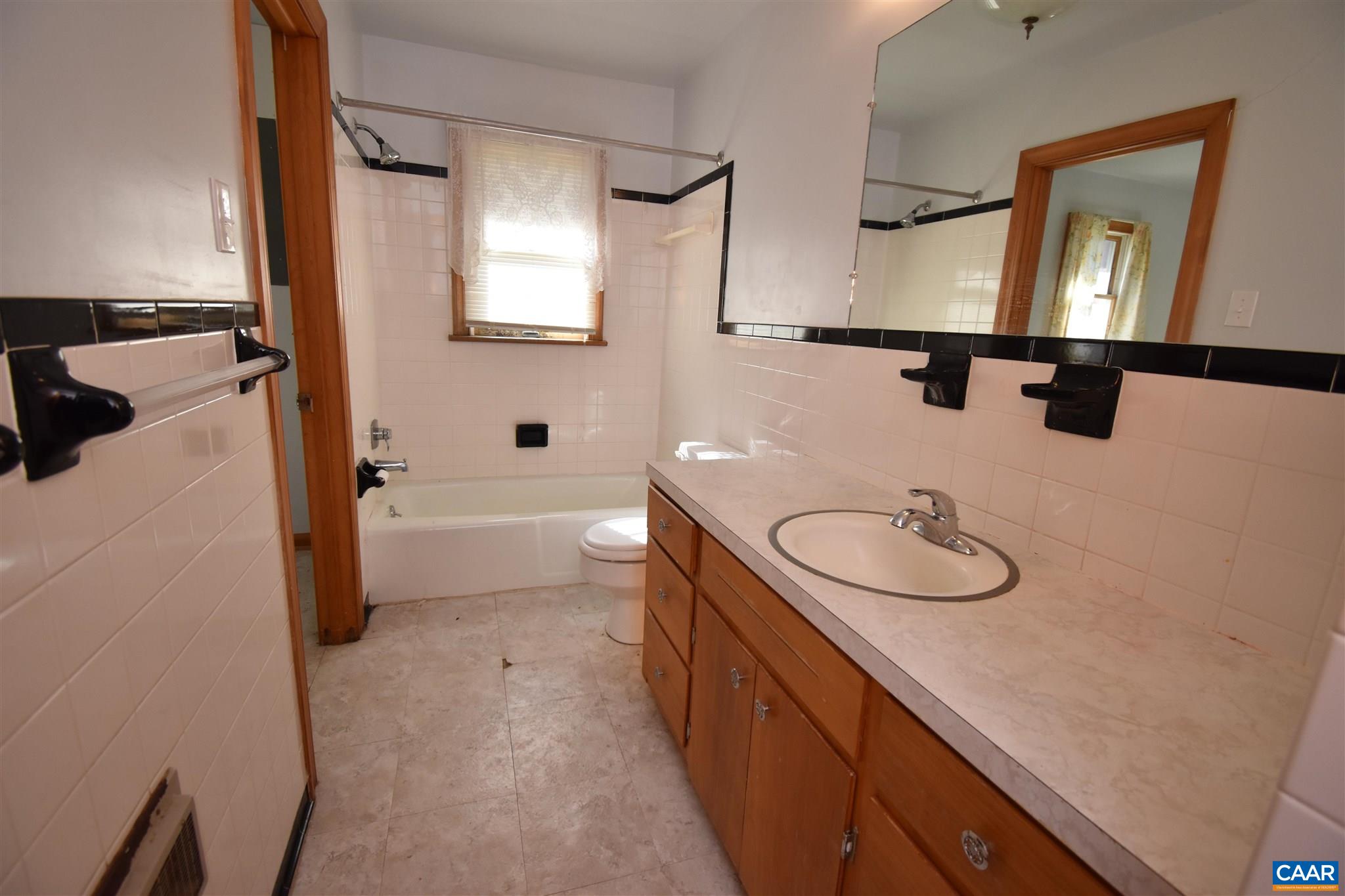 26 Warmar Road Ruckersville, VA 22968 - Photo 19 of 30 a bathroom with a sink a toilet and mirror