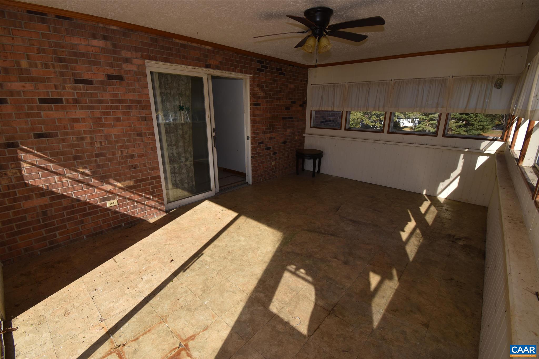26 Warmar Road Ruckersville, VA 22968 - Photo 8 of 30 a view of a porch with a table and chairs