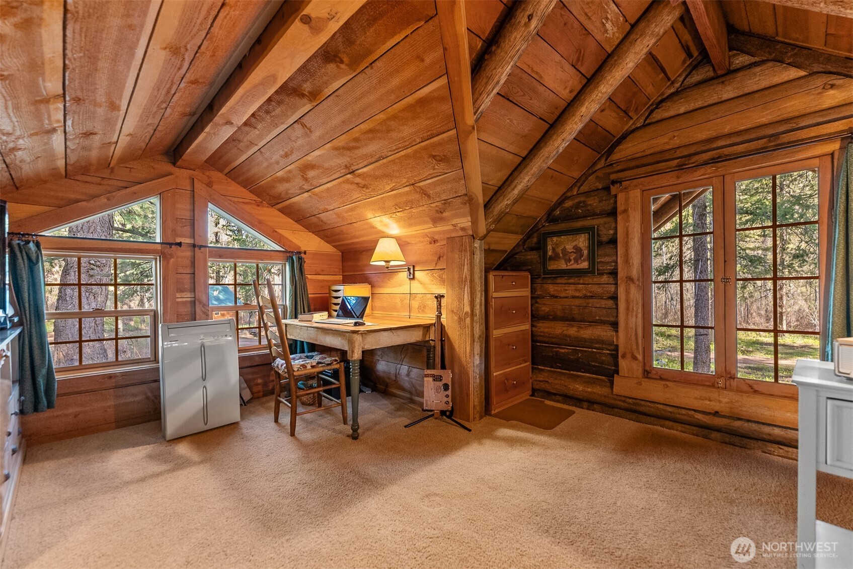 583 B Twisp River Road Twisp, WA 98856 - Photo 11 of 39 a view of a livingroom with furniture and a window
