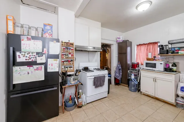 a kitchen with stainless steel appliances and cabinets