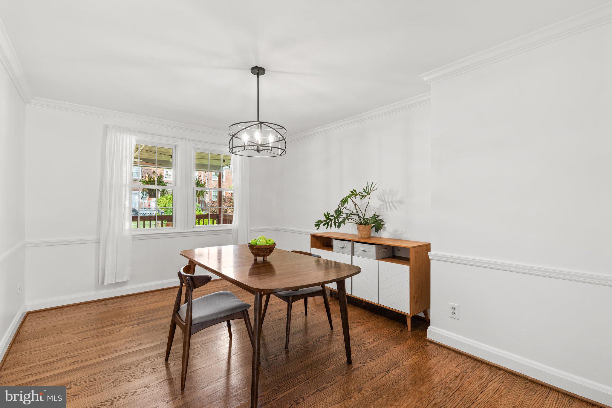 316 Whitfield Road Baltimore, MD 21228 - Photo 8 of 30 a view of a dining room with furniture wooden floor and chandelier