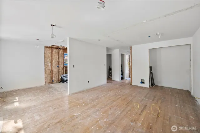 a view of a room with wooden floor