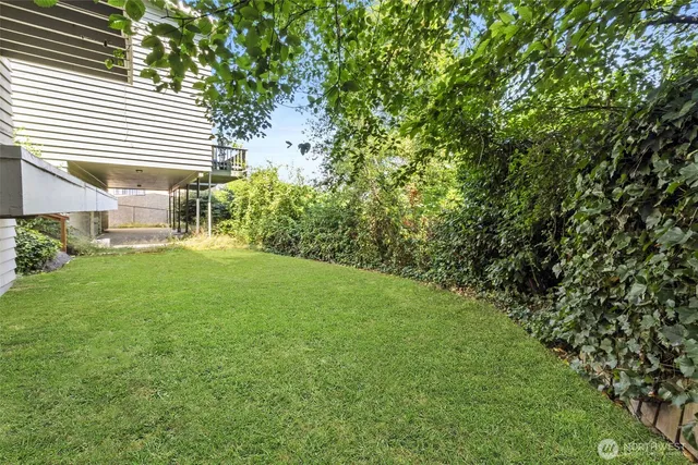 a view of a house with a door and wooden walls