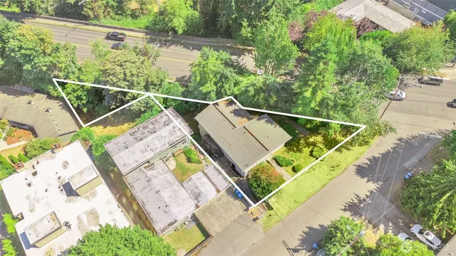 an aerial view of a house with a yard