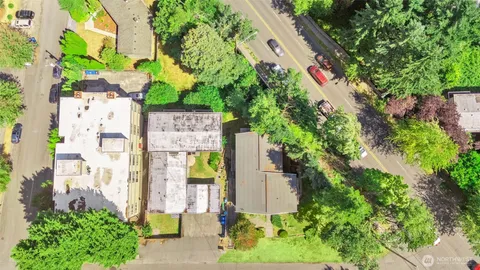 an aerial view of residential house with outdoor space and lake view