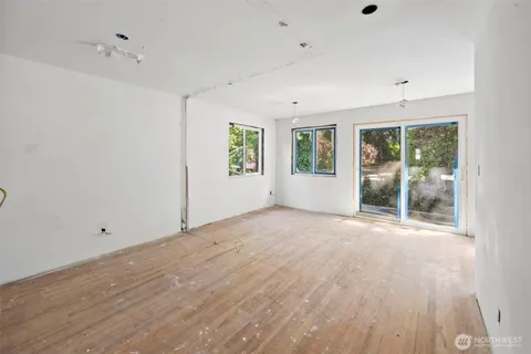 a view of a bathroom with a glass door shower