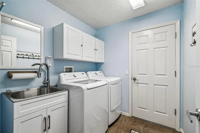 a view of storage and utility room with washer and dryer