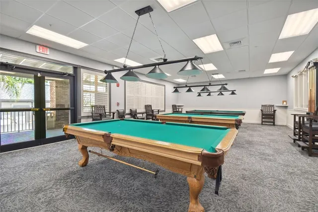 a view of walk in closet with clothes