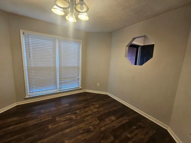 a kitchen with stainless steel appliances granite countertop sink refrigerator and microwave