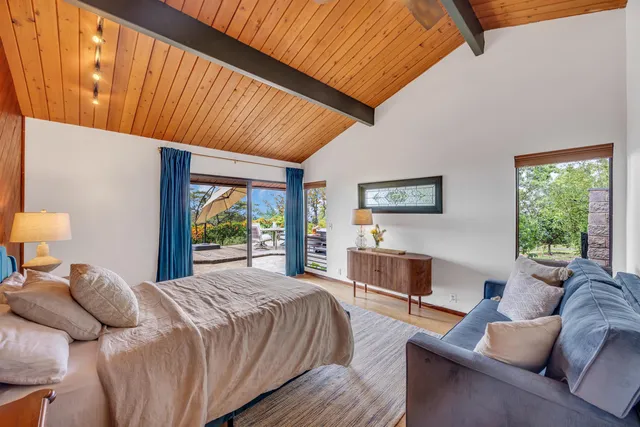 a bed room with a bed and a couch