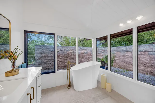 a living room with furniture and a tub