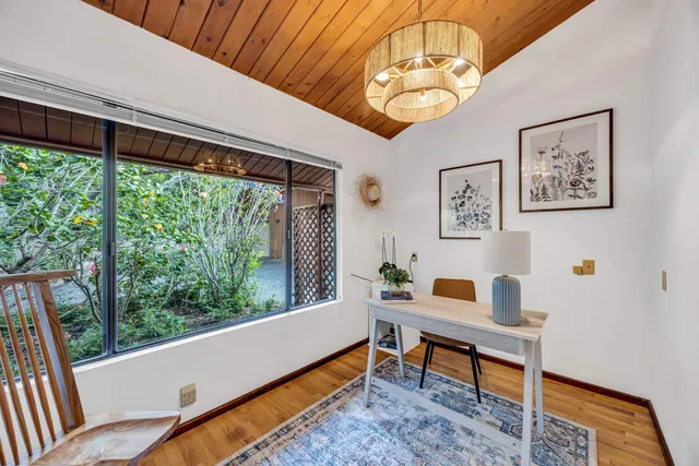 a reading room with furniture and a window