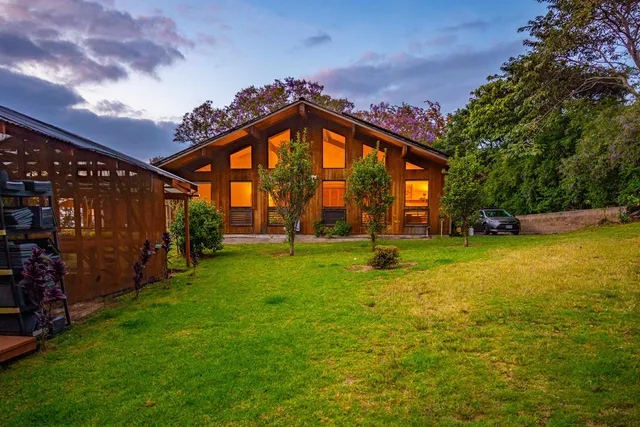 a view of swimming pool is middle in the garden