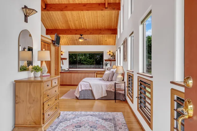 a living room with furniture fireplace and flat screen tv