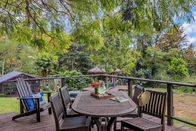 a view of balcony with furniture and wooden deck