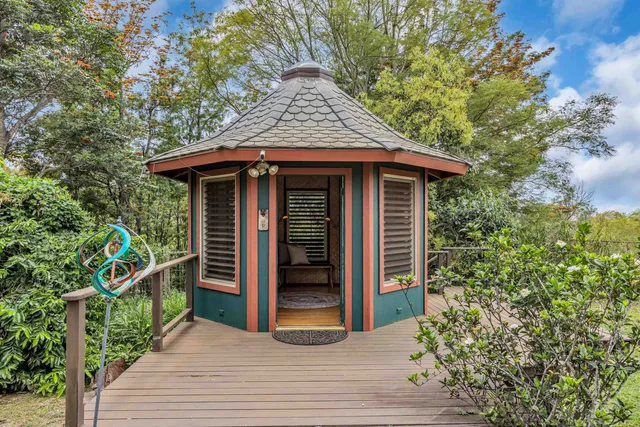 a view of a wooden door and a bench