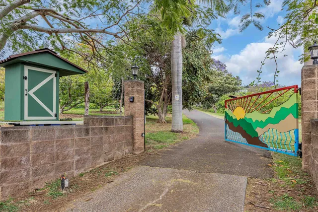 a view of a wooden door and a yard