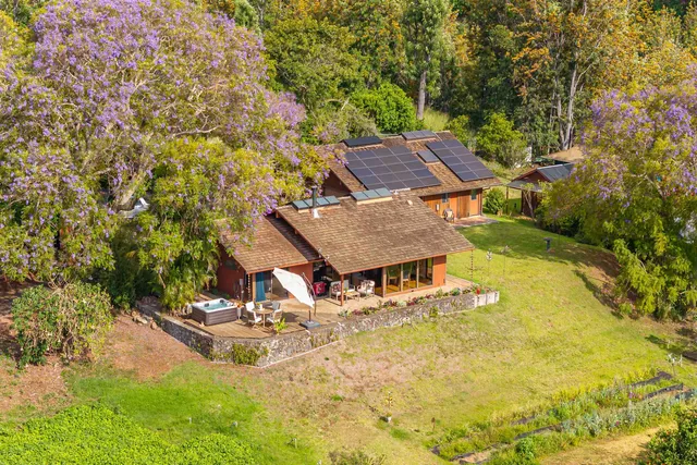 a view of a patio with a table and chairs