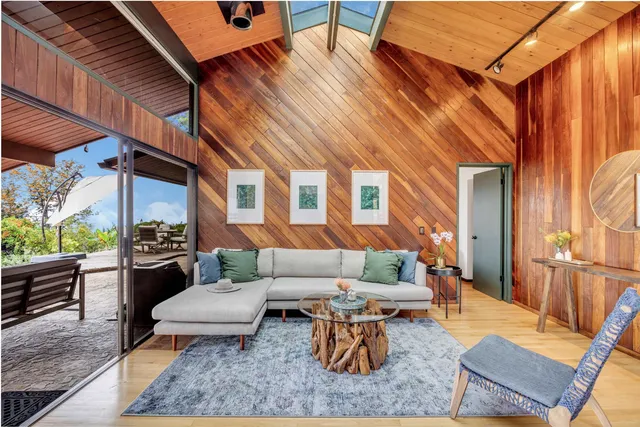 a backyard of a house with outdoor seating