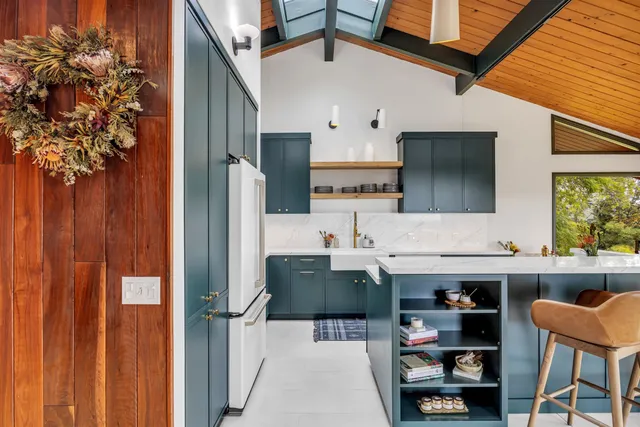 a view of a kitchen with furniture and a kitchen