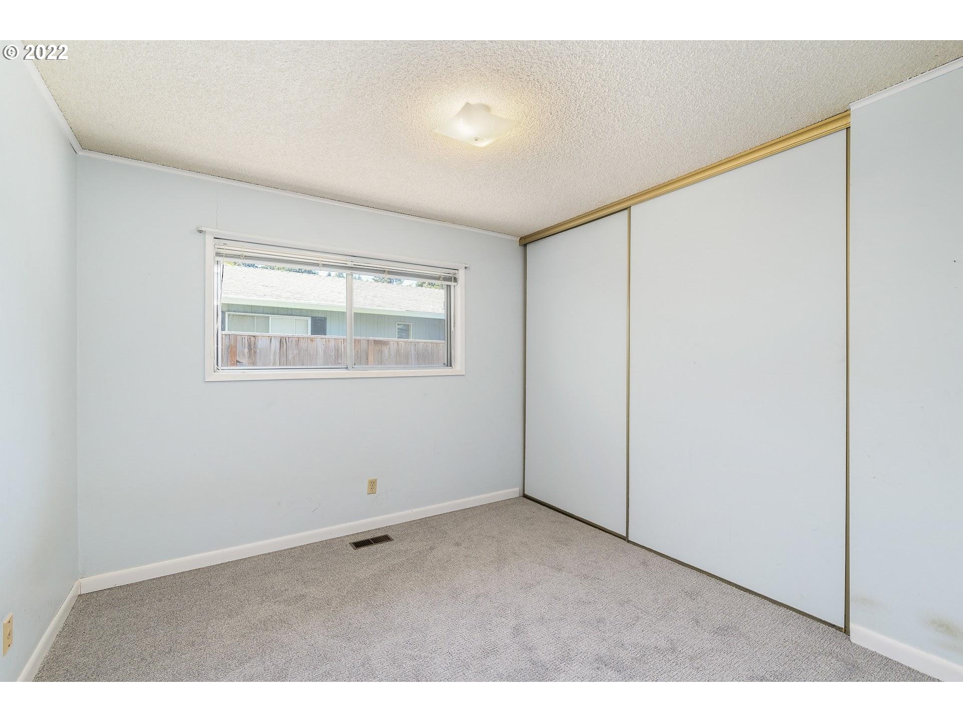 10880 Southwest Pathfinder Way Tigard, OR 97223 - Photo 16 of 26 a view of an empty room with a window