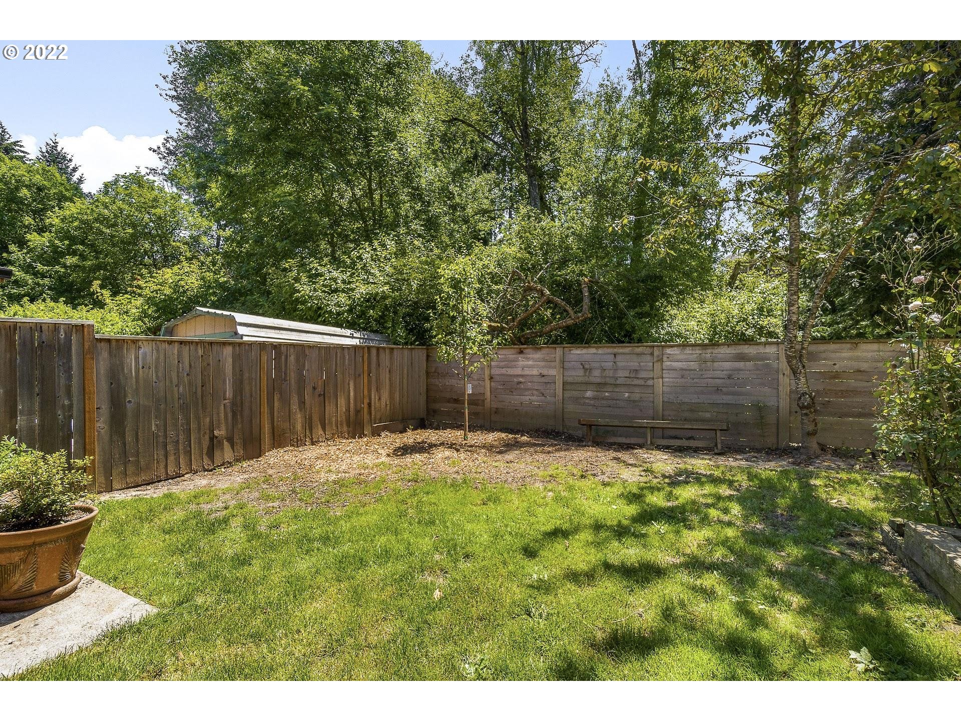 10880 Southwest Pathfinder Way Tigard, OR 97223 - Photo 20 of 26 a backyard of a house with lots of green space