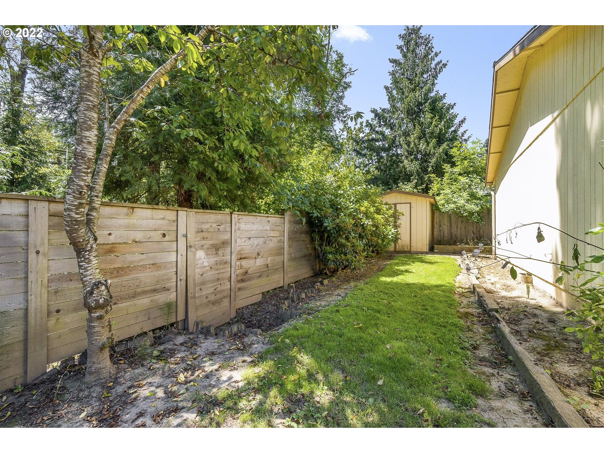 10880 Southwest Pathfinder Way Tigard, OR 97223 - Photo 21 of 26 a view of a backyard