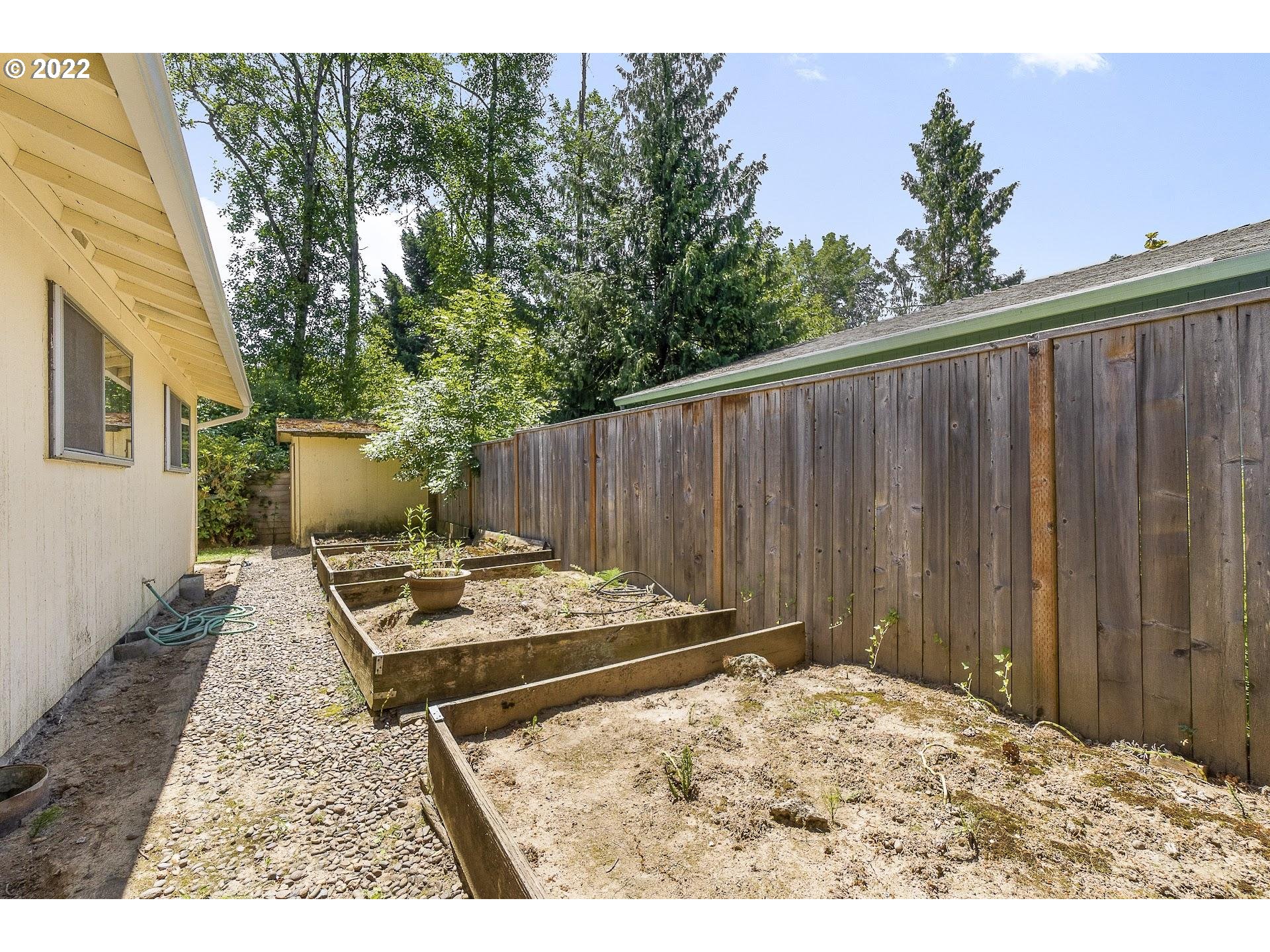 10880 Southwest Pathfinder Way Tigard, OR 97223 - Photo 22 of 26 a backyard of a house with yard and furniture