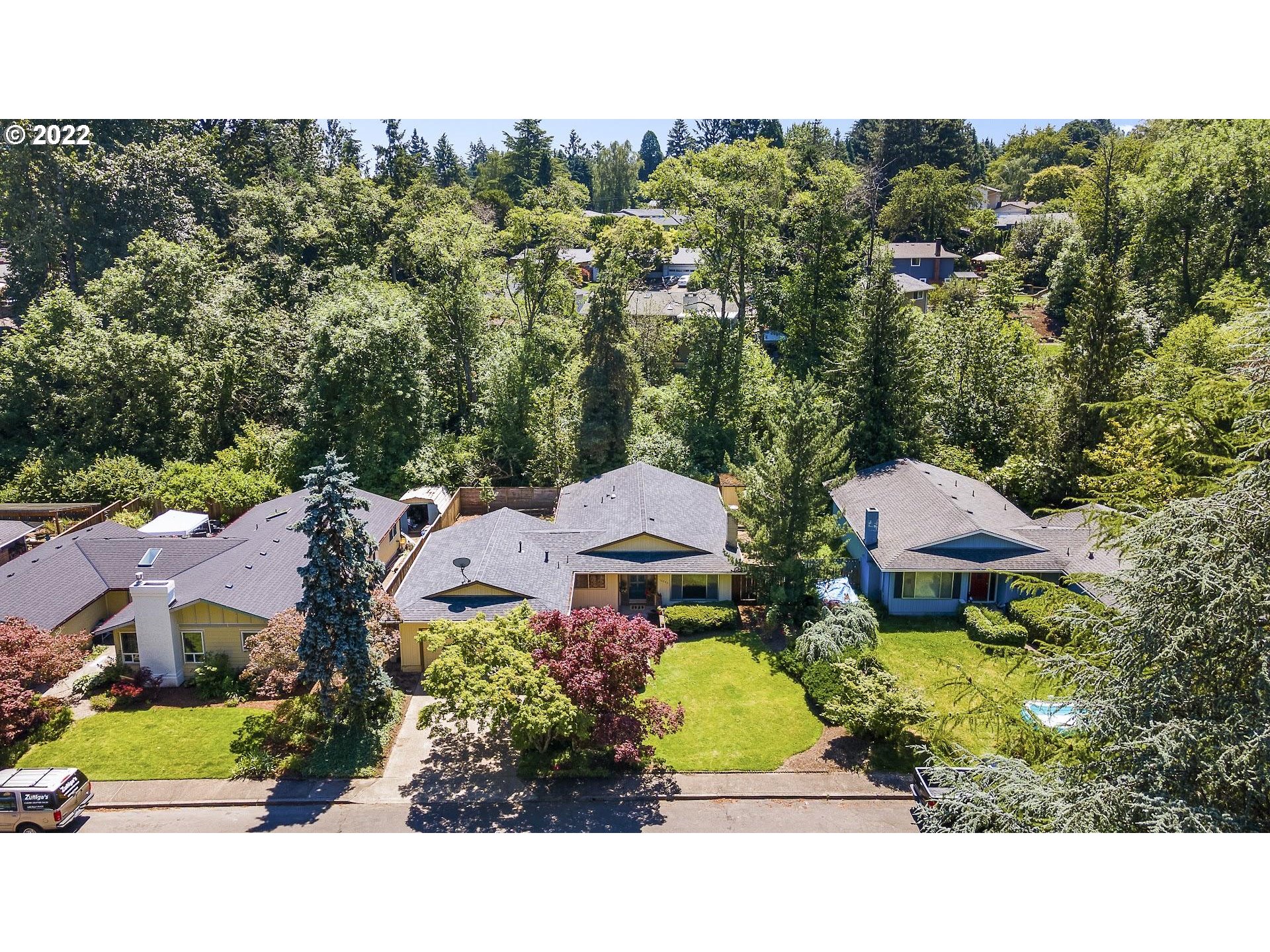 10880 Southwest Pathfinder Way Tigard, OR 97223 - Photo 23 of 26 an aerial view of a house with a garden