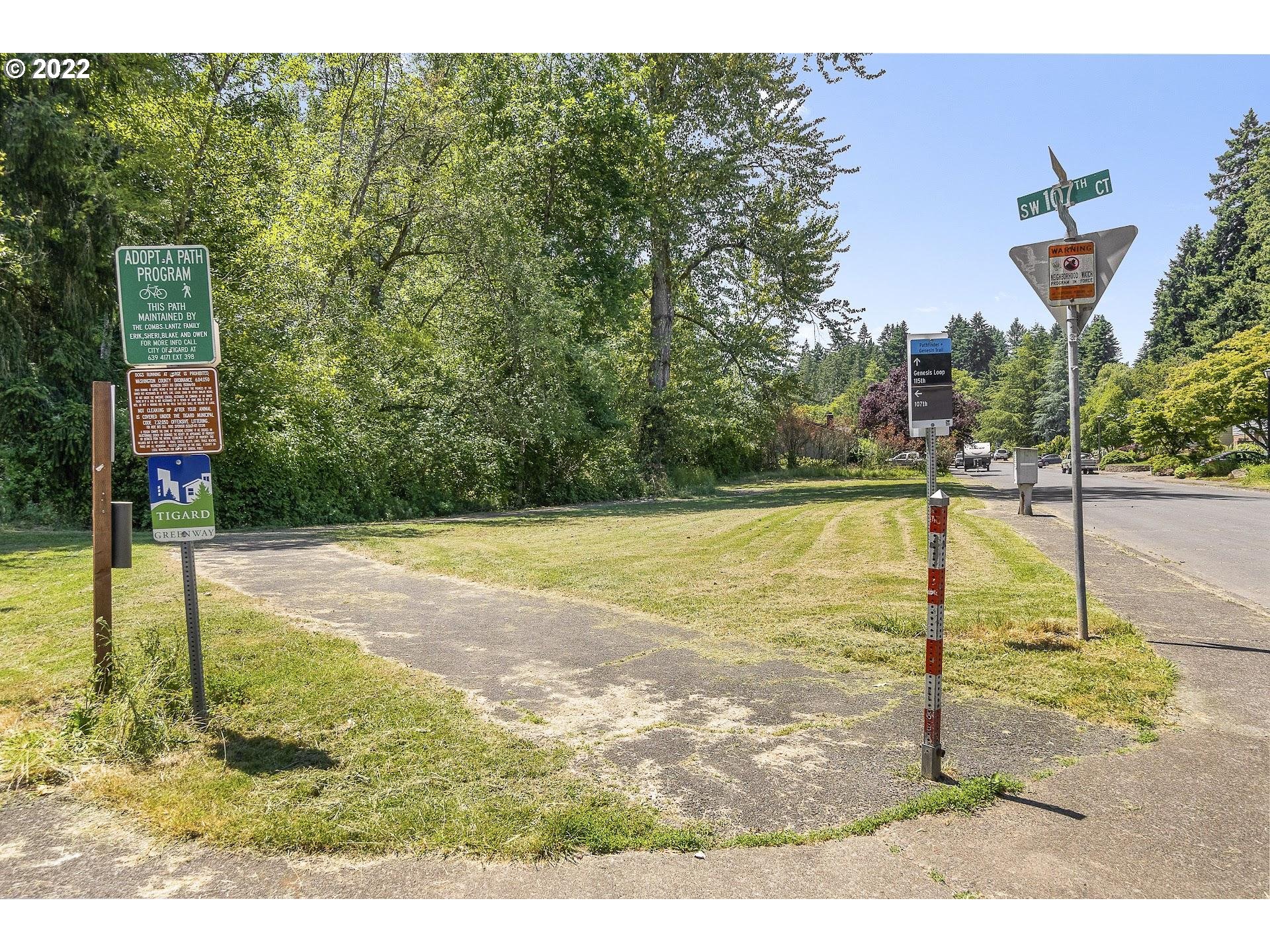 10880 Southwest Pathfinder Way Tigard, OR 97223 - Photo 26 of 26 a swimming pool with some trees in the background