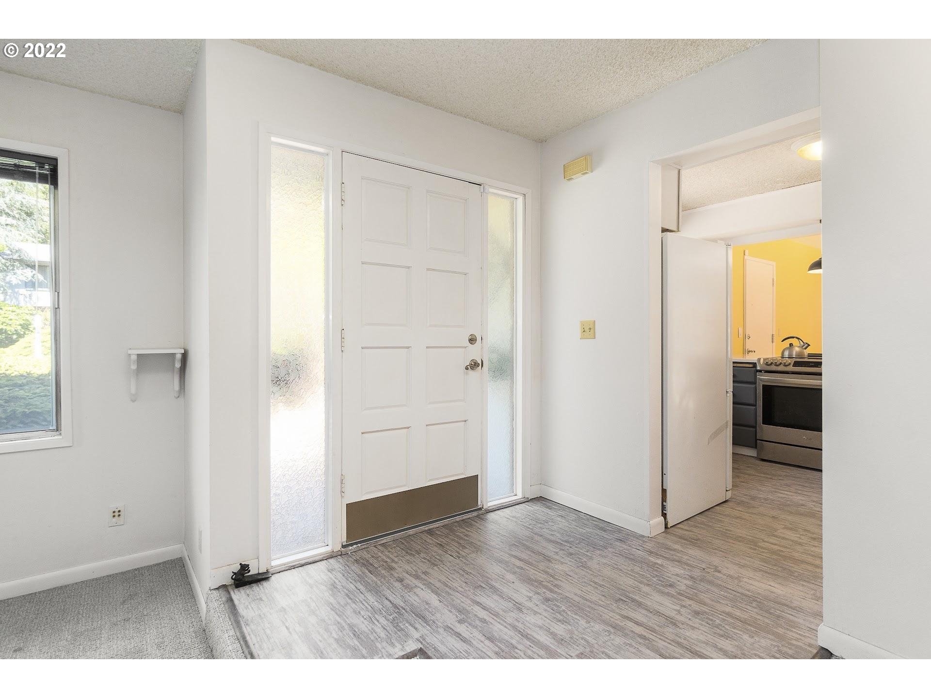 10880 Southwest Pathfinder Way Tigard, OR 97223 - Photo 3 of 26 a view interior of the house and wooden floor