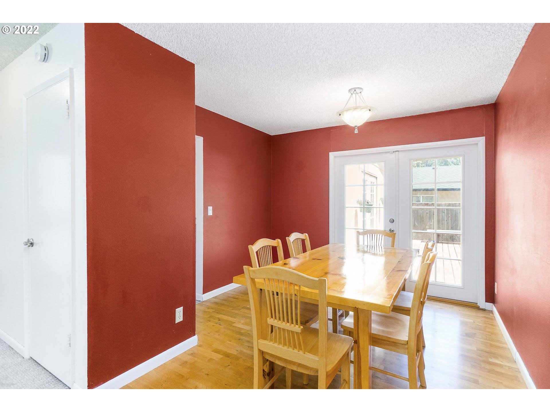 10880 Southwest Pathfinder Way Tigard, OR 97223 - Photo 10 of 26 a dining room with furniture and window