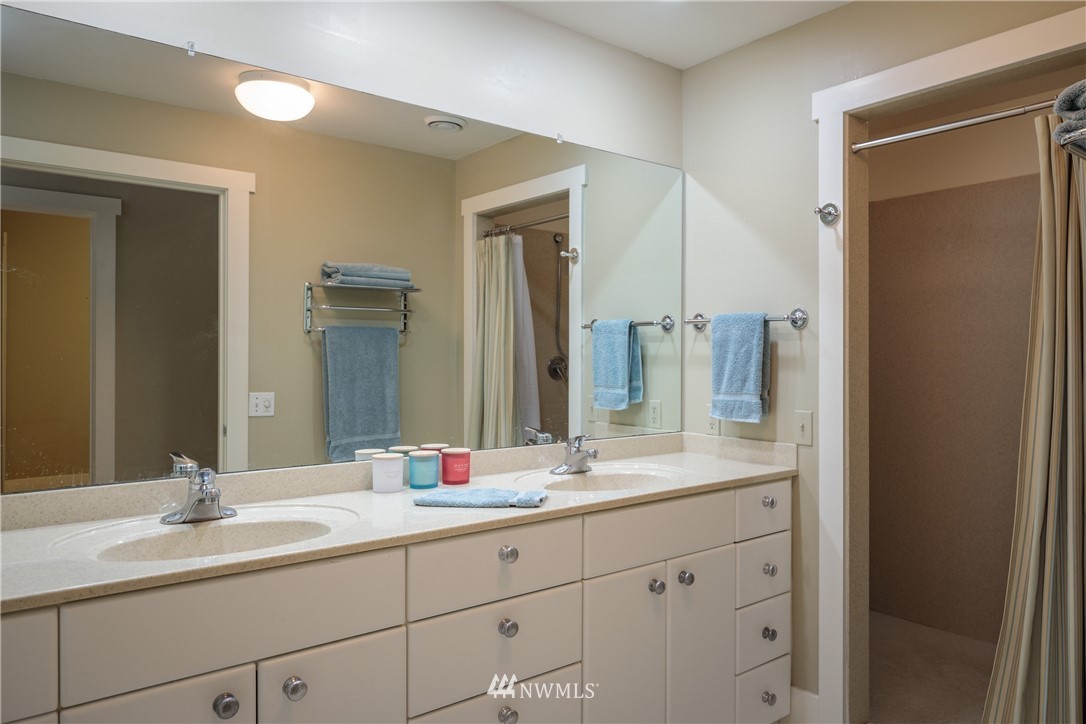525 Port Stanley Road Lopez Island, WA 98261 - Photo 13 of 28 a bathroom with a double vanity sink mirror and double