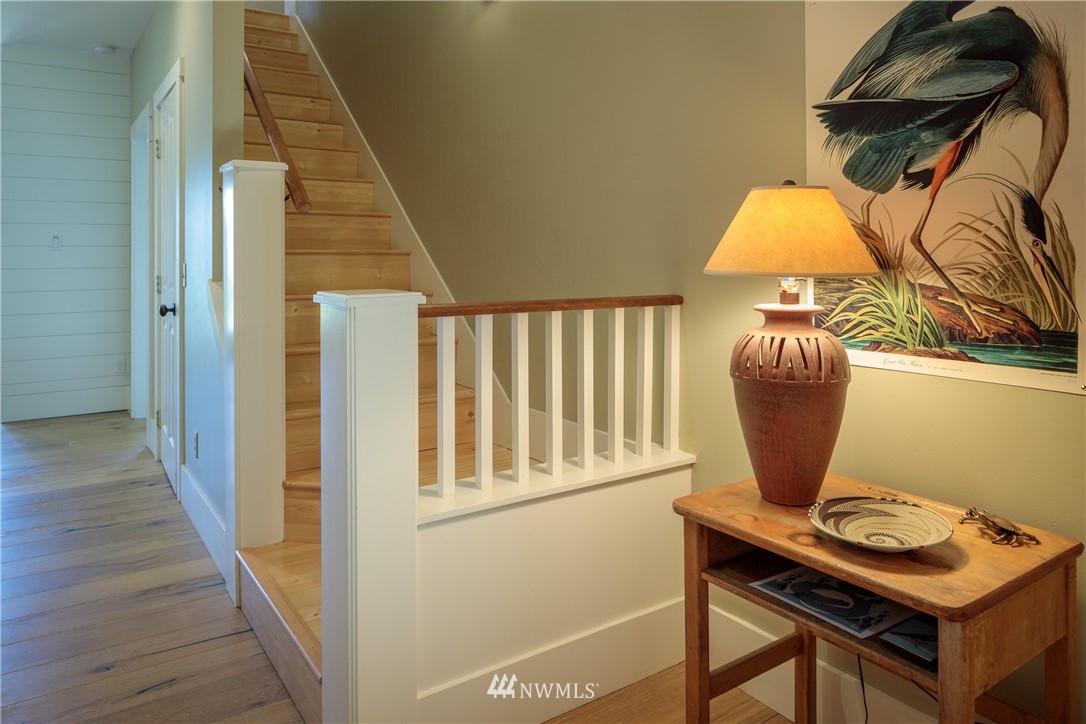 525 Port Stanley Road Lopez Island, WA 98261 - Photo 17 of 28 a view of a hallway with furniture