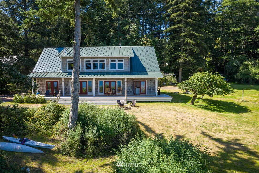 525 Port Stanley Road Lopez Island, WA 98261 - Photo 5 of 28 a front view of a house with a yard