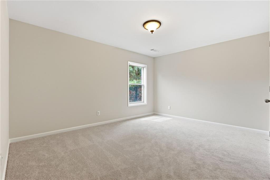 1515 Riva Ridge Suwanee, GA 30024 - Photo 24 of 35 an empty room with windows
