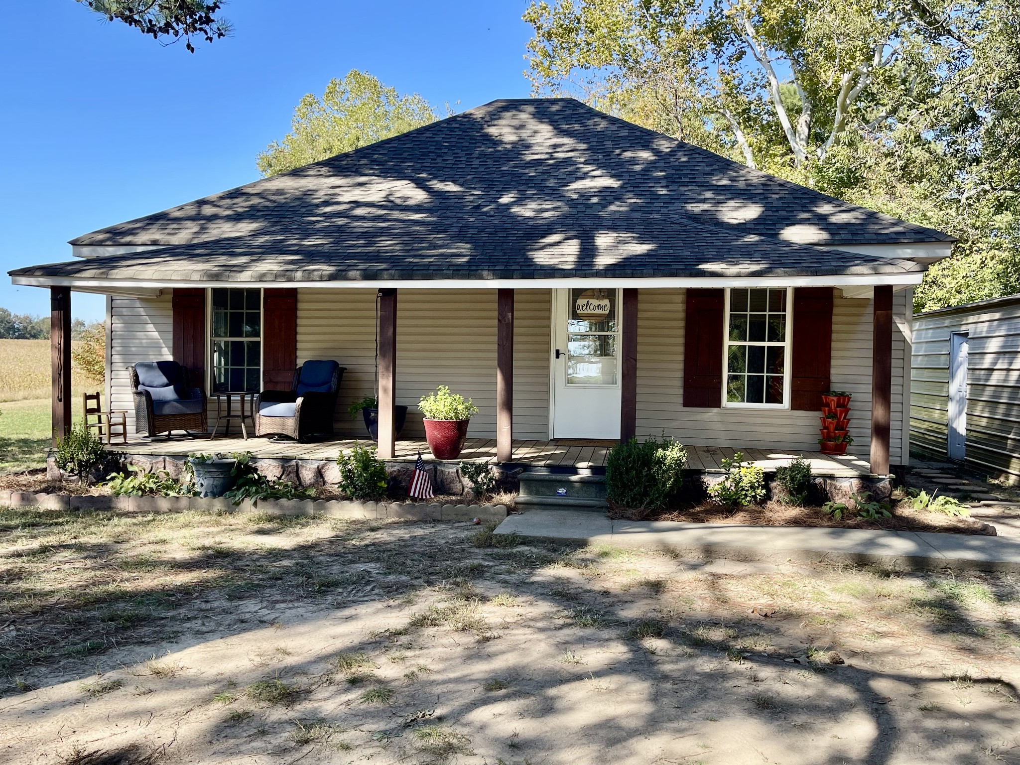 319 Jim Jackson Road Humboldt, TN 38343 - Photo 1 of 63 a view of a house with backyard sitting area and porch