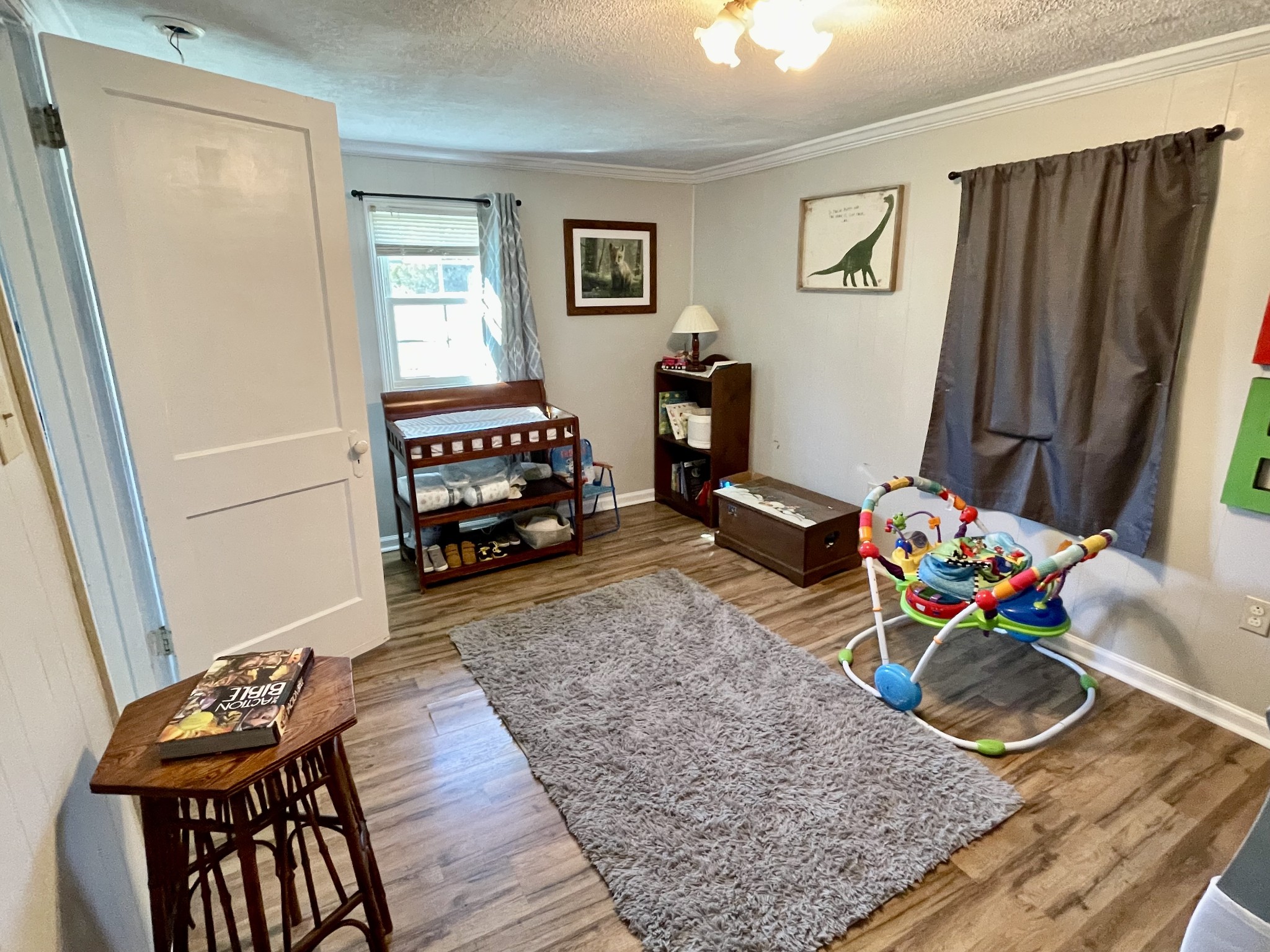 319 Jim Jackson Road Humboldt, TN 38343 - Photo 19 of 63 a bedroom with furniture and a wooden floor