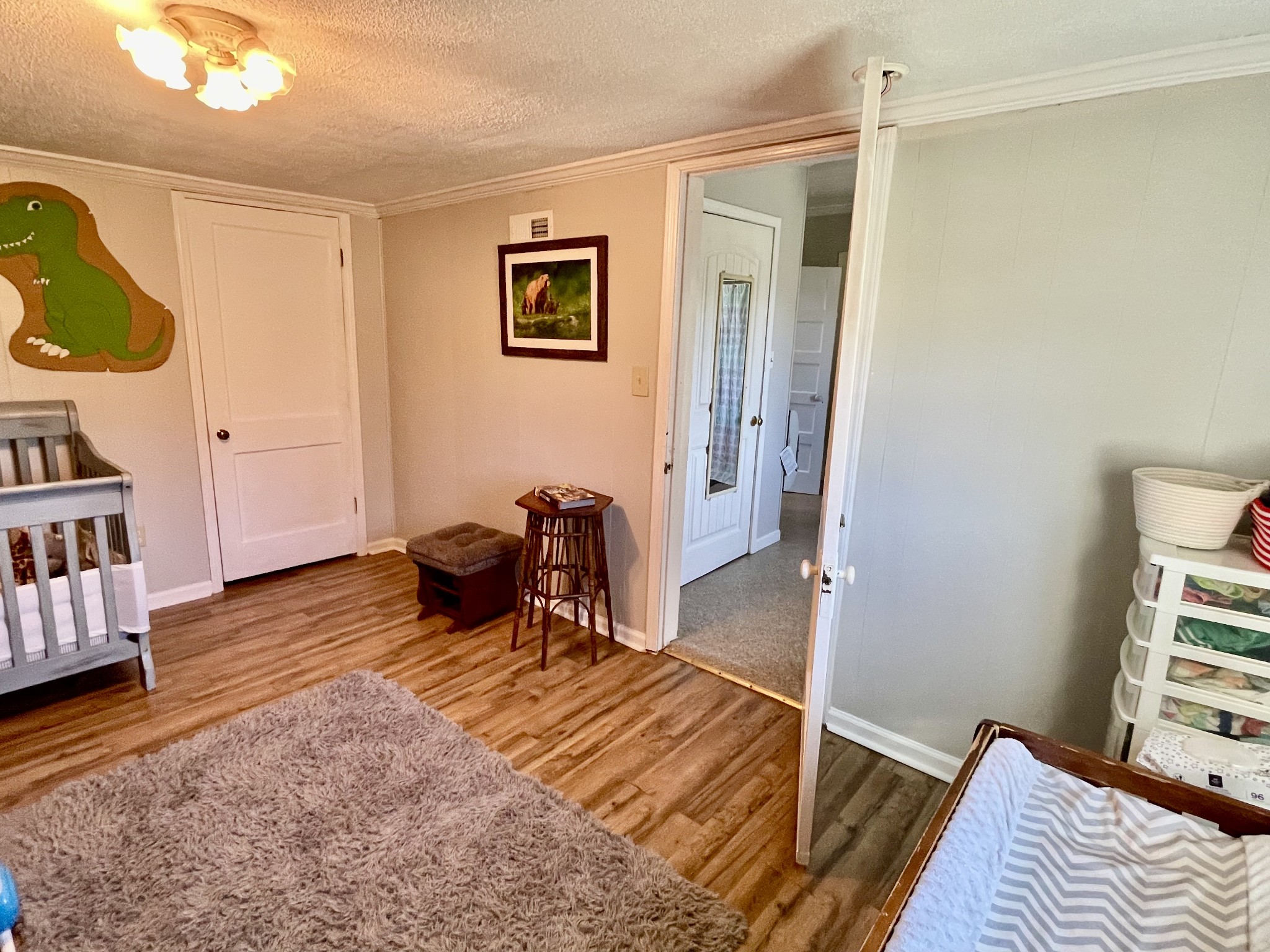 319 Jim Jackson Road Humboldt, TN 38343 - Photo 20 of 63 a bedroom with a bed and wooden floor