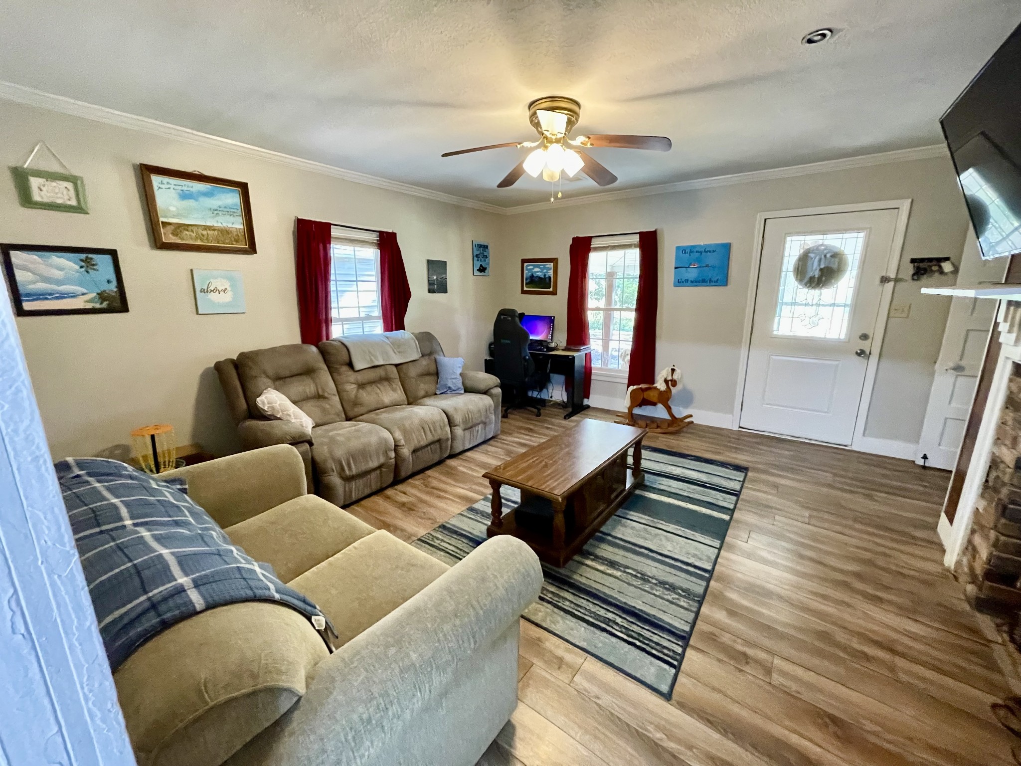 319 Jim Jackson Road Humboldt, TN 38343 - Photo 2 of 63 a living room with furniture and a wooden floor
