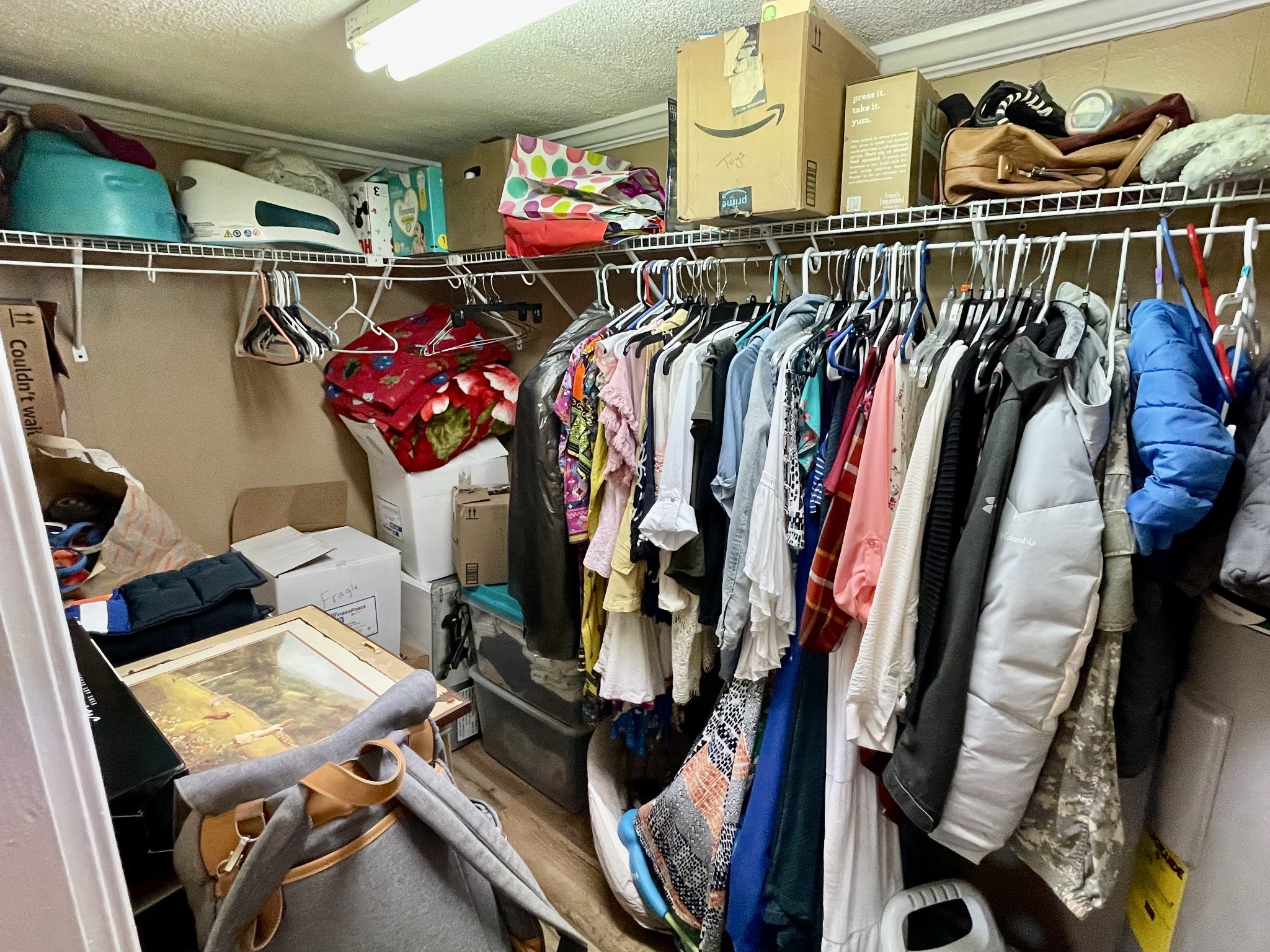 319 Jim Jackson Road Humboldt, TN 38343 - Photo 21 of 63 a view of walk in closet with clothes and shoes