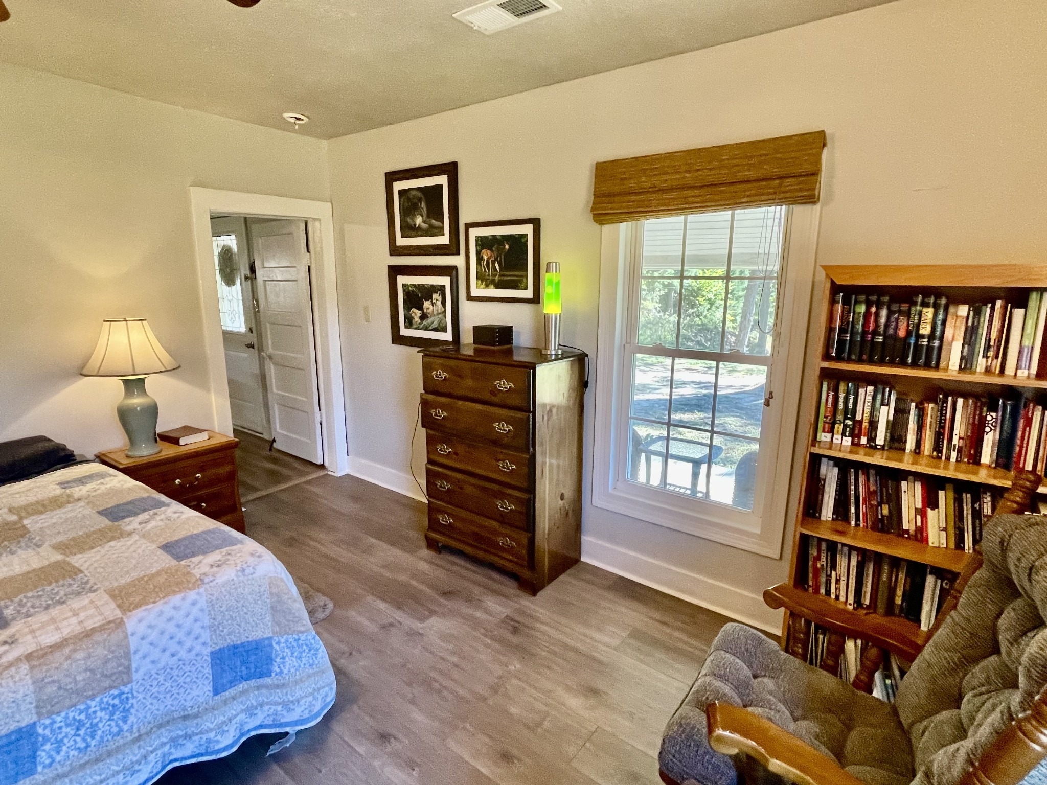 319 Jim Jackson Road Humboldt, TN 38343 - Photo 24 of 63 a bedroom with a bed and a book shelf