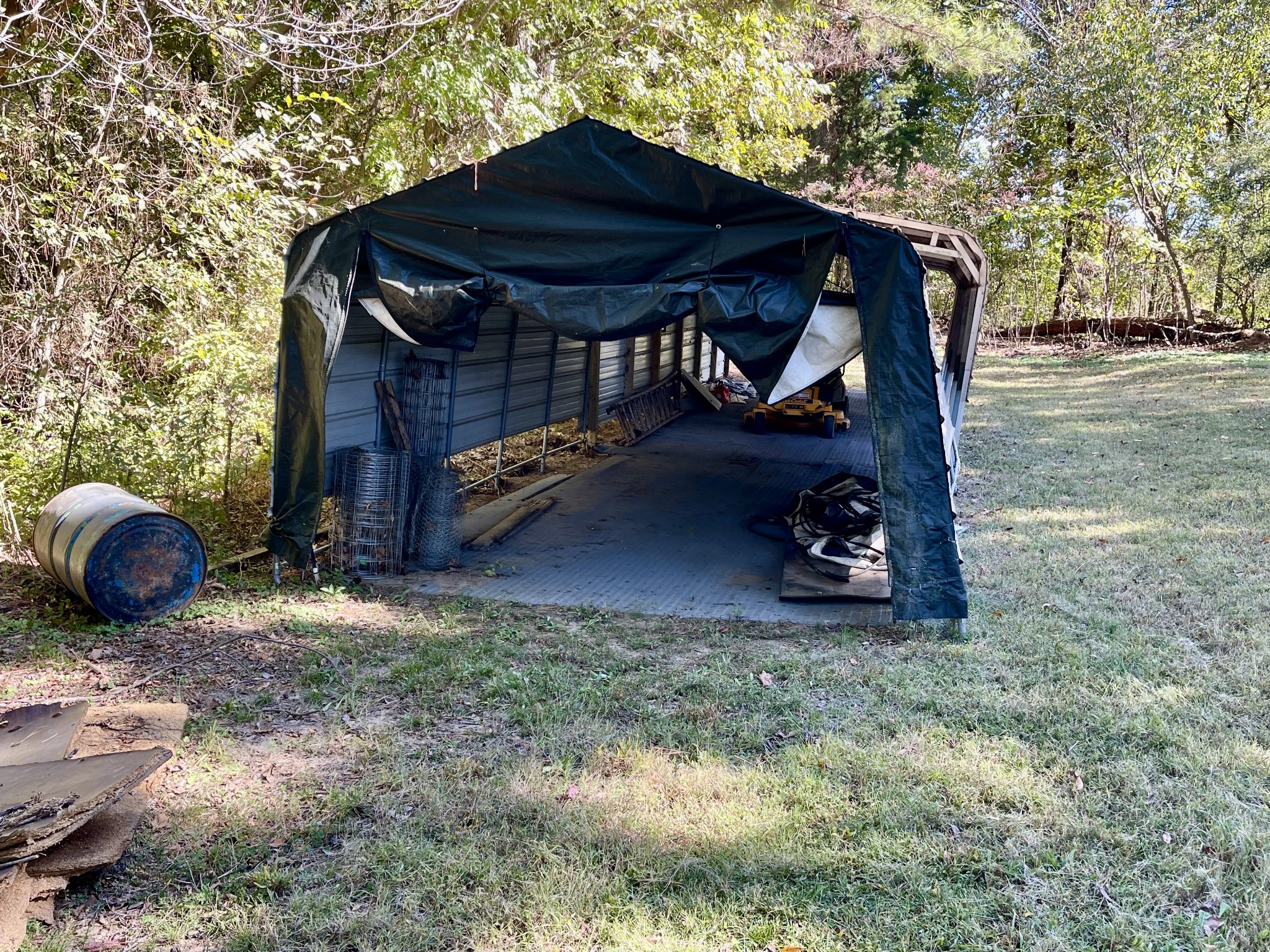 319 Jim Jackson Road Humboldt, TN 38343 - Photo 42 of 63 a view of backyard with barn table and chairs under an umbrella