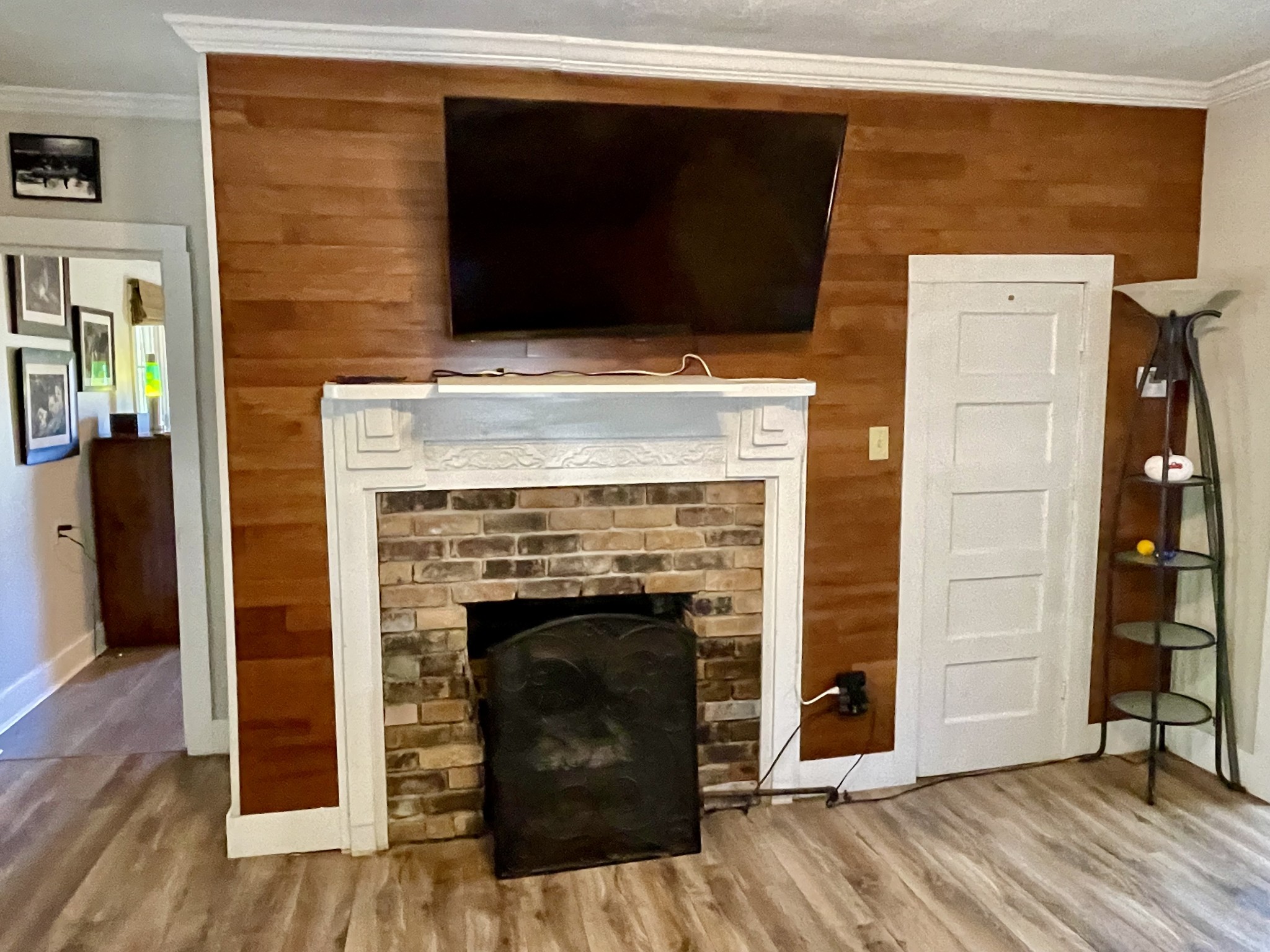 319 Jim Jackson Road Humboldt, TN 38343 - Photo 7 of 63 a living room with a fireplace and a wooden floor