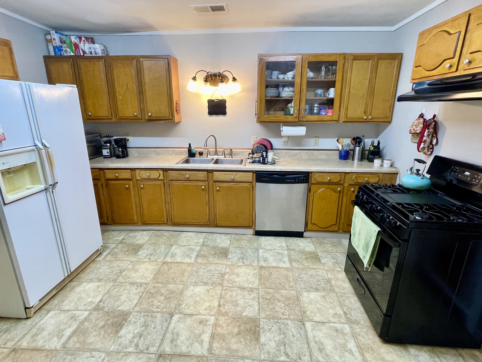 319 Jim Jackson Road Humboldt, TN 38343 - Photo 8 of 63 a kitchen with stainless steel appliances granite countertop a stove a sink and a refrigerator