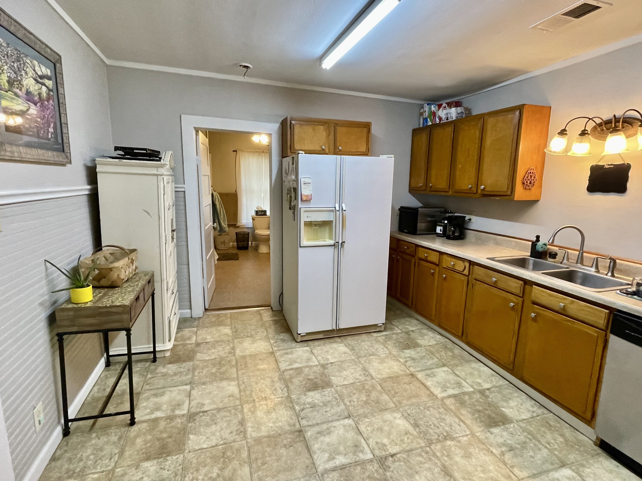 319 Jim Jackson Road Humboldt, TN 38343 - Photo 9 of 63 a kitchen with stainless steel appliances granite countertop a refrigerator and a sink