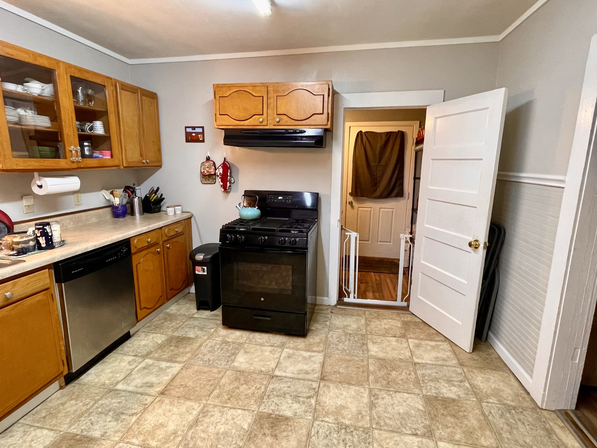 319 Jim Jackson Road Humboldt, TN 38343 - Photo 10 of 63 a kitchen with stainless steel appliances granite countertop a stove a sink and a refrigerator