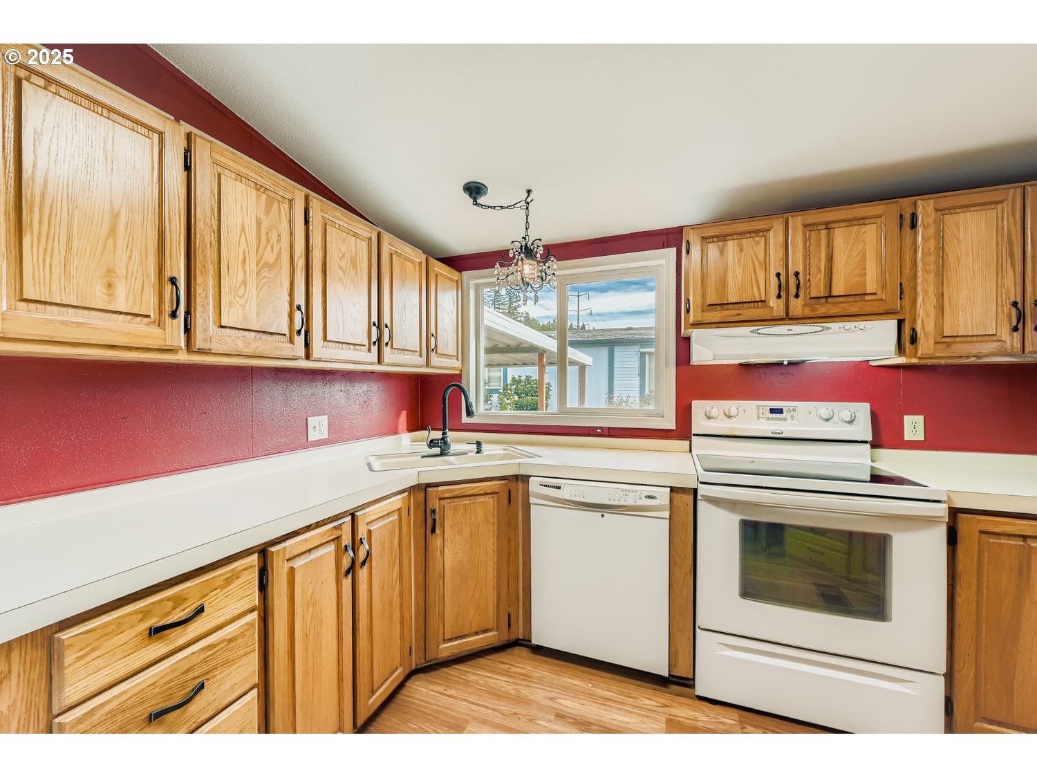 100 Southwest 195th Avenue, Unit 104 Beaverton, OR 97006 - Photo 3 of 23 a kitchen with a stove a sink and a microwave