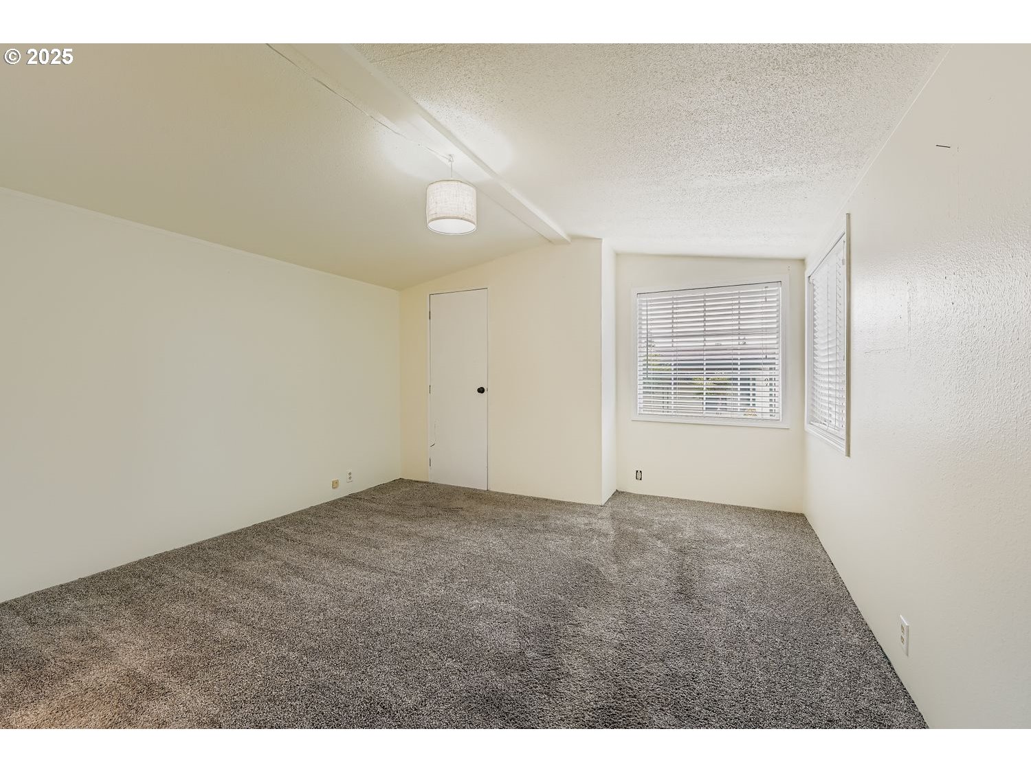 100 Southwest 195th Avenue, Unit 104 Beaverton, OR 97006 - Photo 8 of 23 an empty room with windows